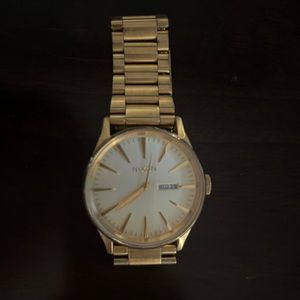 Men’s Nixon gold watch. Hardly worn- does need a new battery